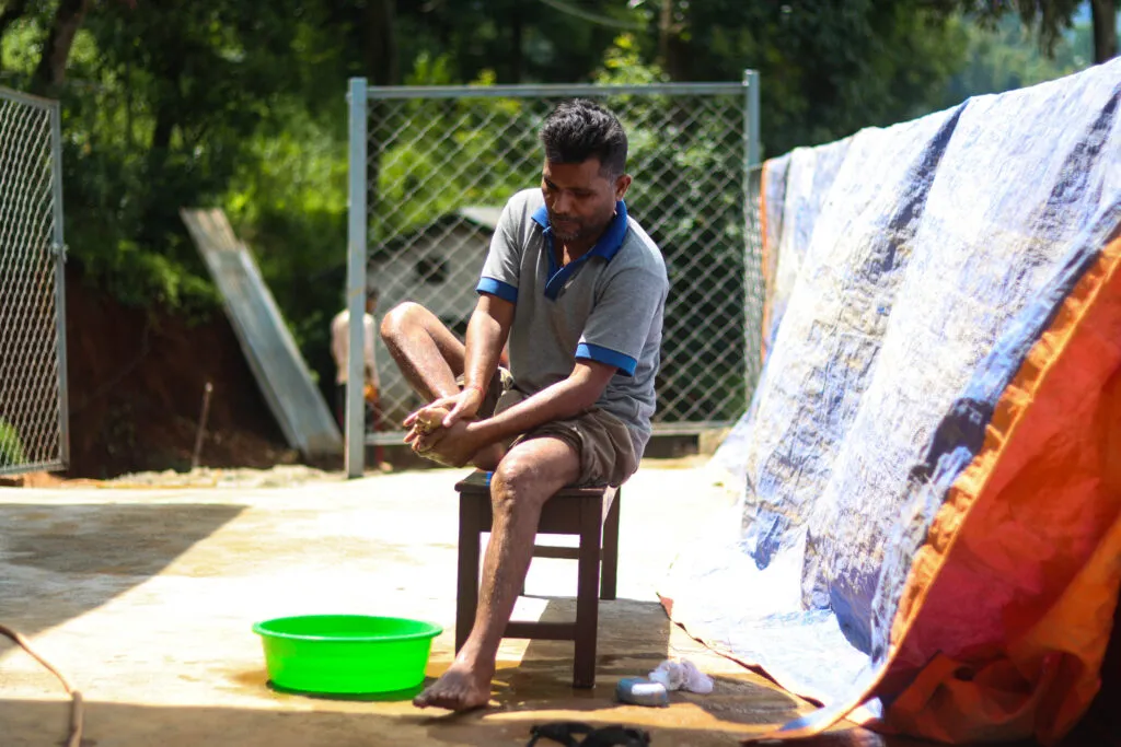 Person affected by leprosy in Nepal participating in daily life within their community