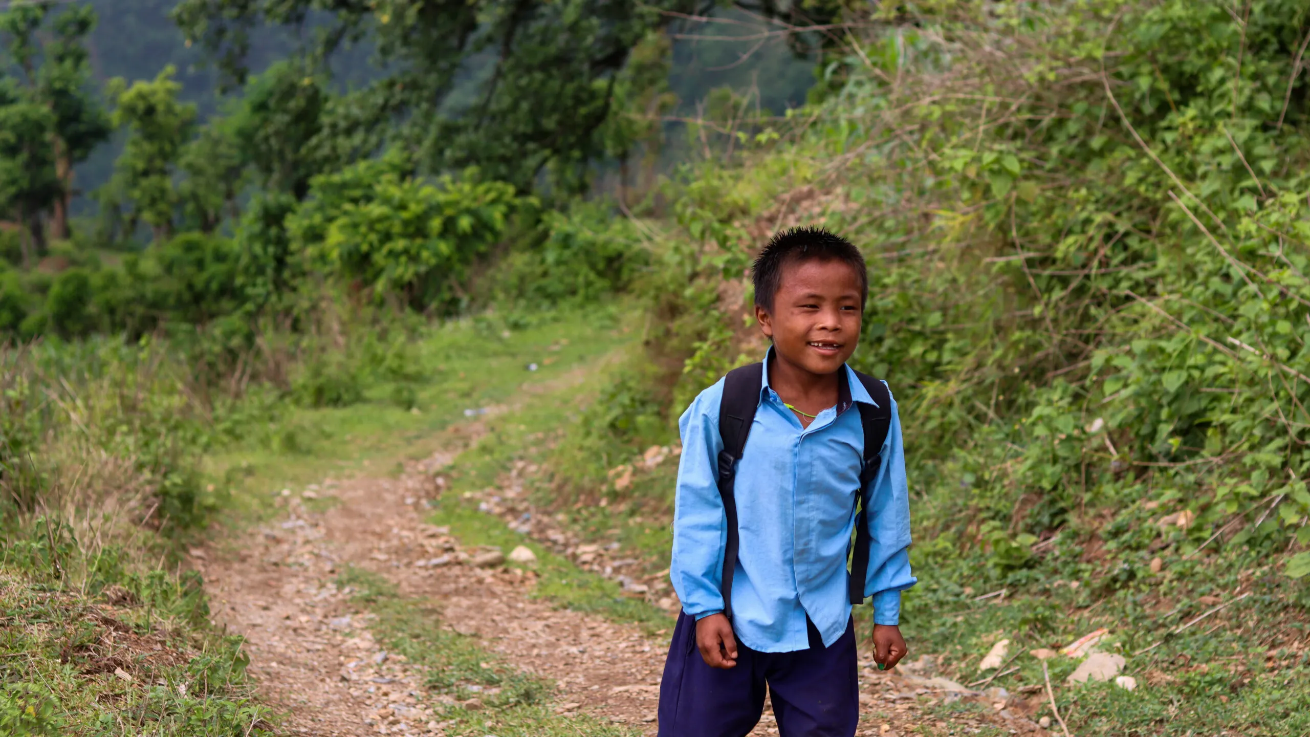 An individual going about daily work in their community following recovery from illness.