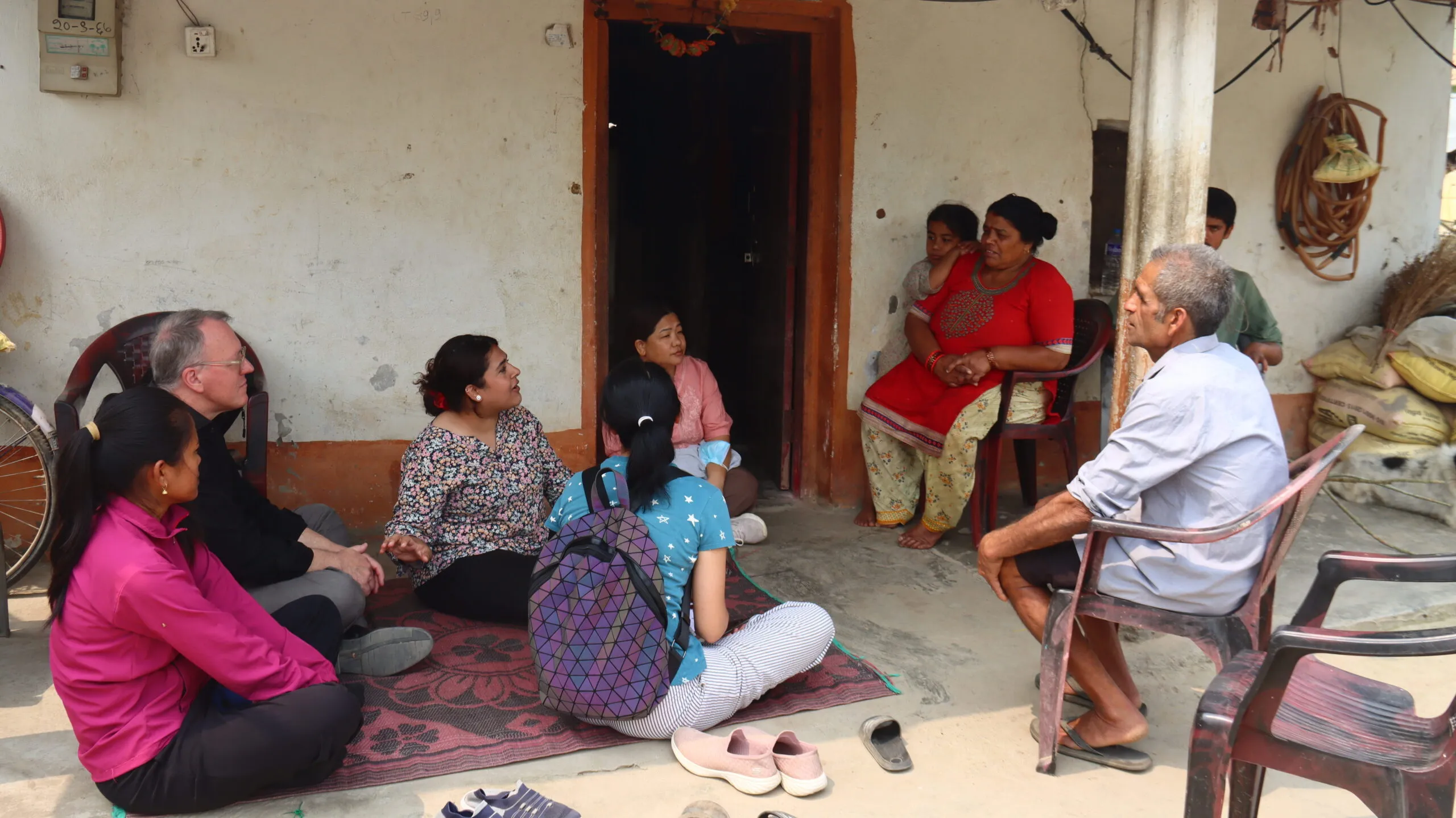 A group of community members gathered together in a meeting or shared activity.