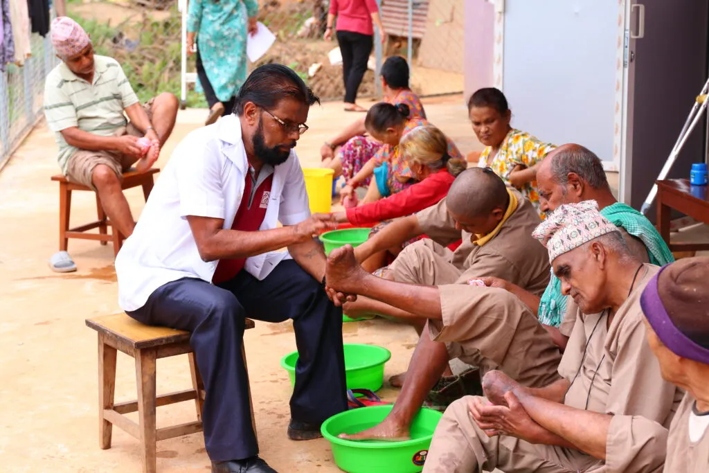 Health worker consulting with patient at a community clinic.