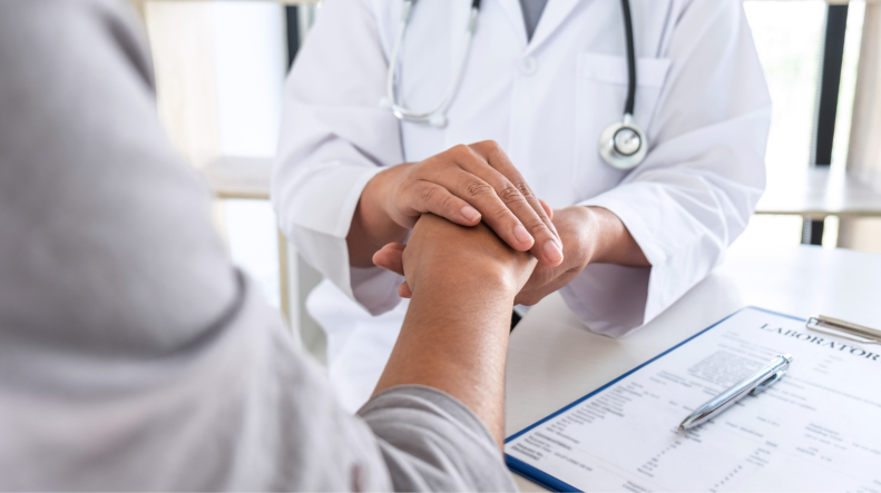 Woman consulting with healthcare professional in a supportive environment.