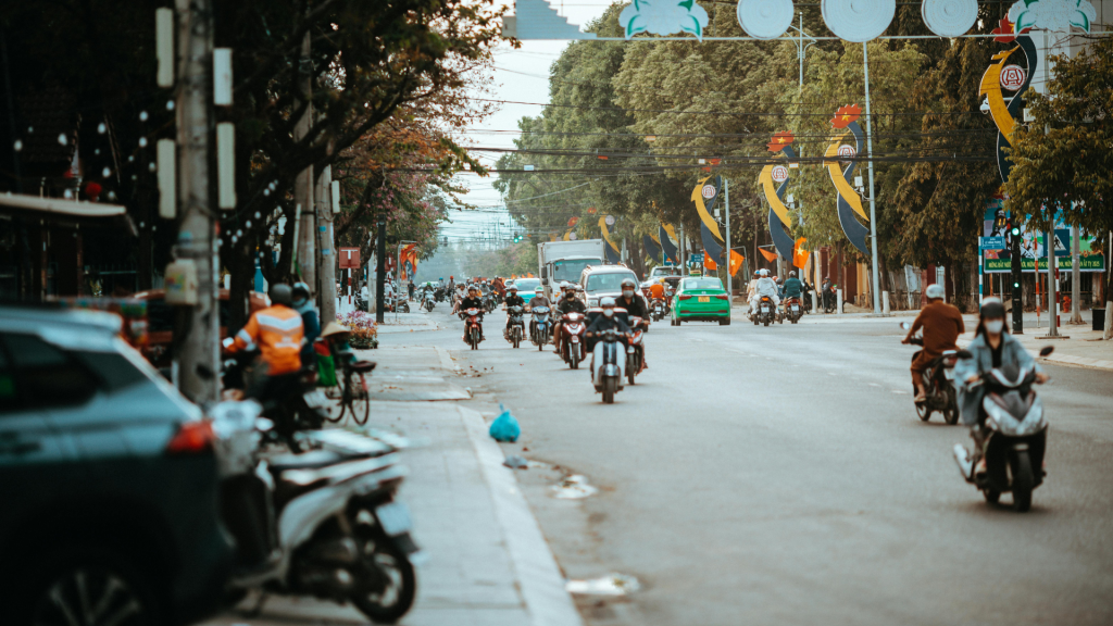 A healthcare worker traveling through a rural area to reach patients despite access challenges.