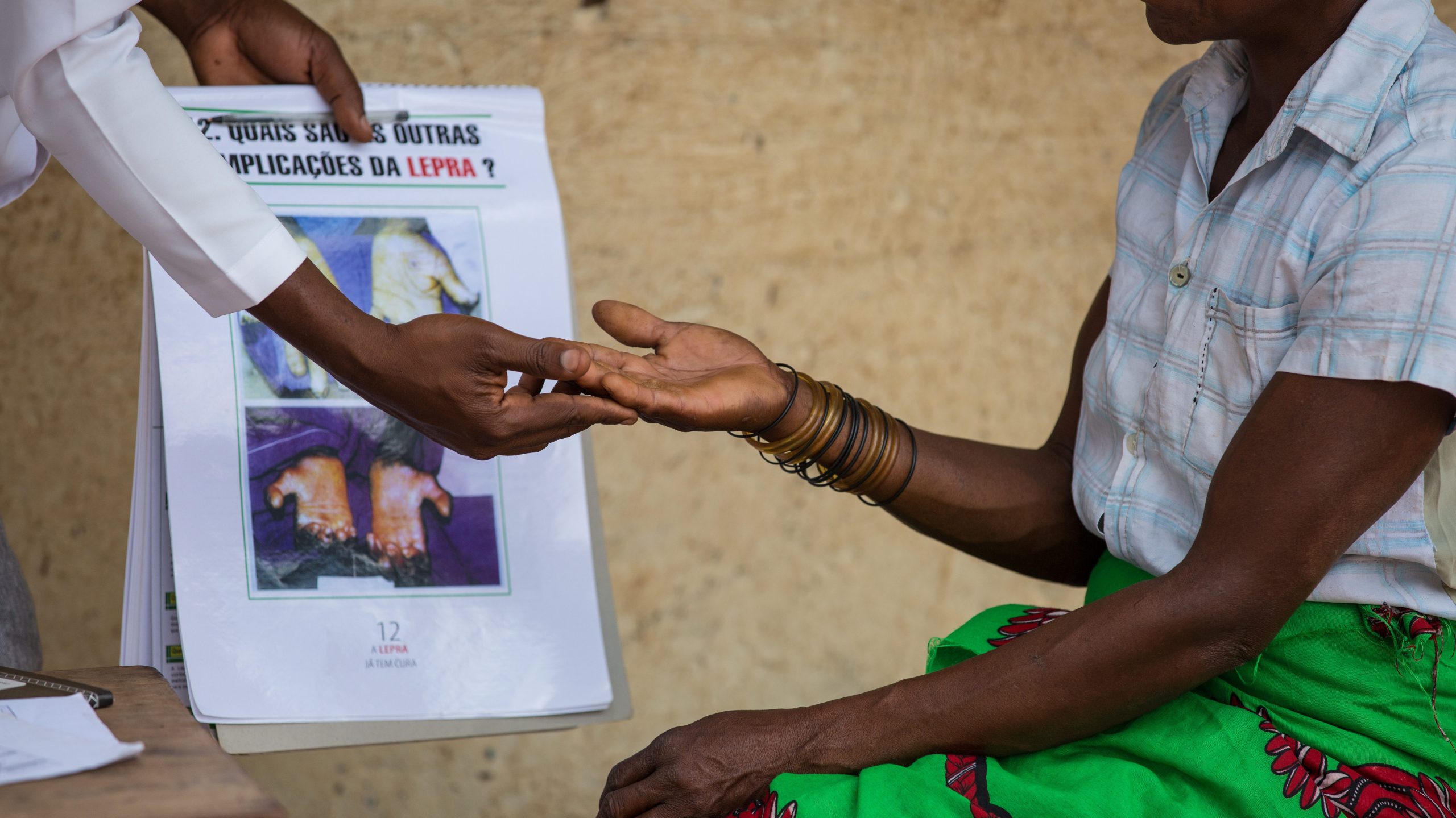 A sparsely equipped clinic interior showing limited medical supplies and infrastructure challenges.