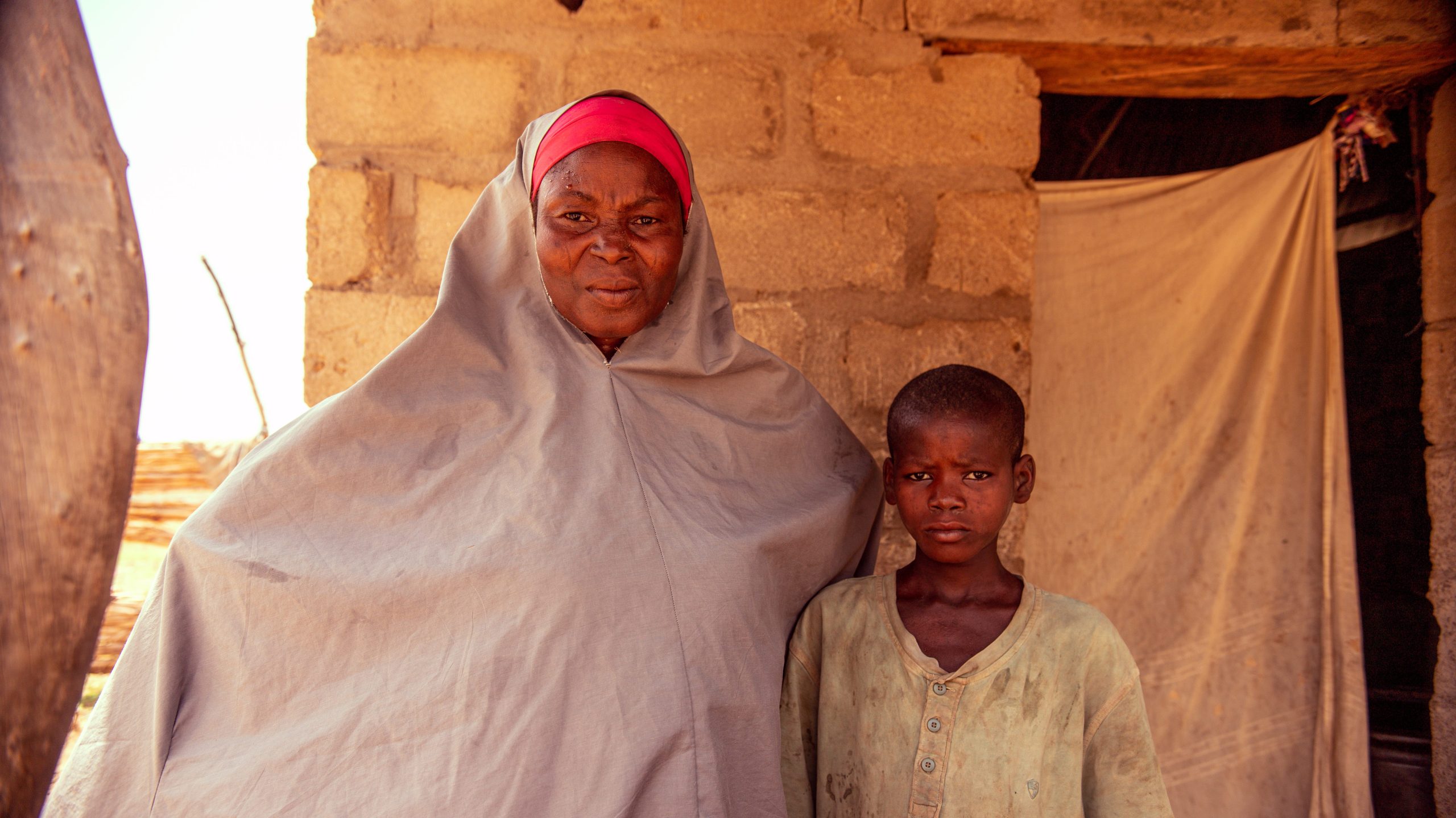 A mother and child in Nigeria standing close together.