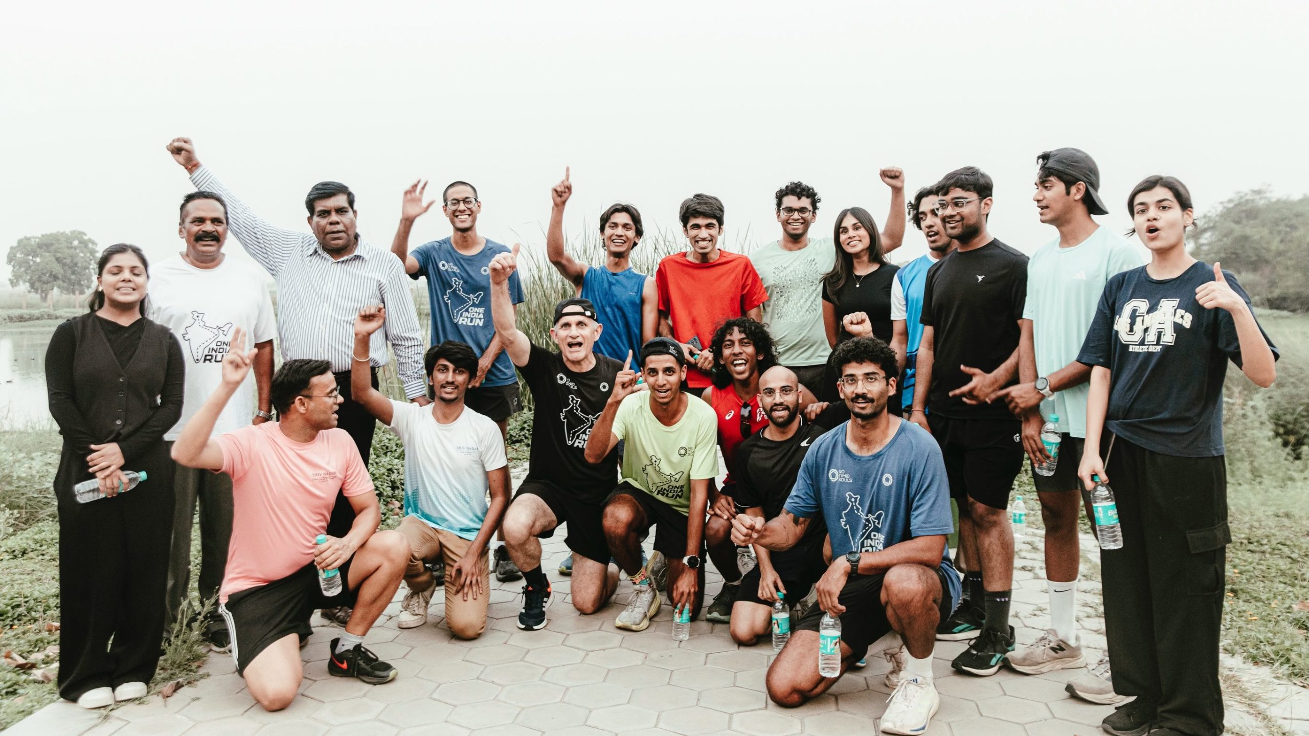 Crowds and local supporters cheering Om Satija during the One India Run through Indian villages