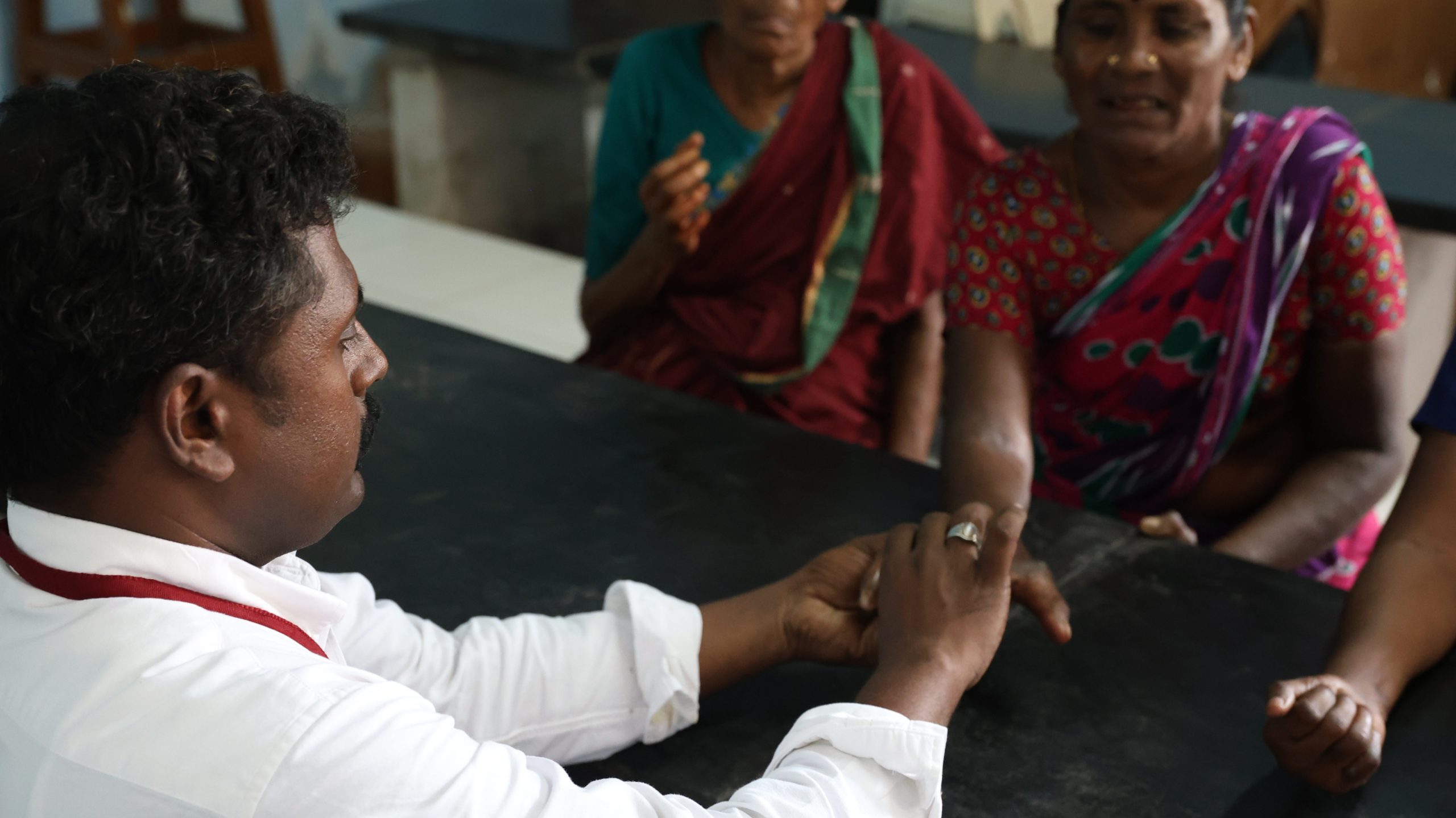 Healthcare worker providing education about leprosy in a rural health clinic