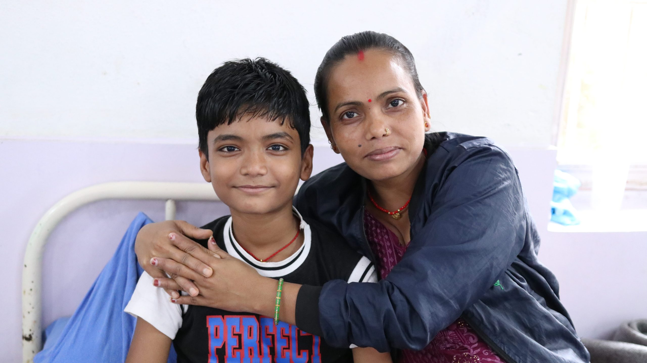 Rhitik and his mother together during treatment after his diagnosis of leprosy.