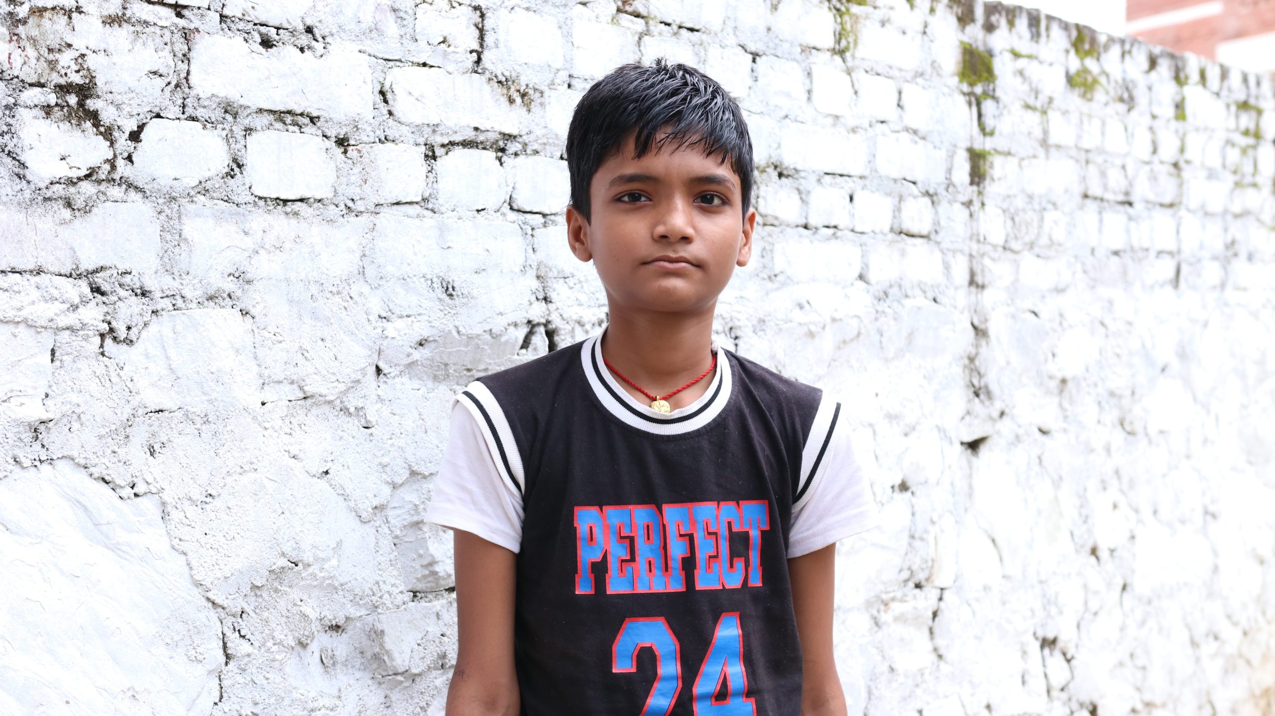 Portrait of Rhitik, a young boy from Nepal who was diagnosed with leprosy after years of medical uncertainty.