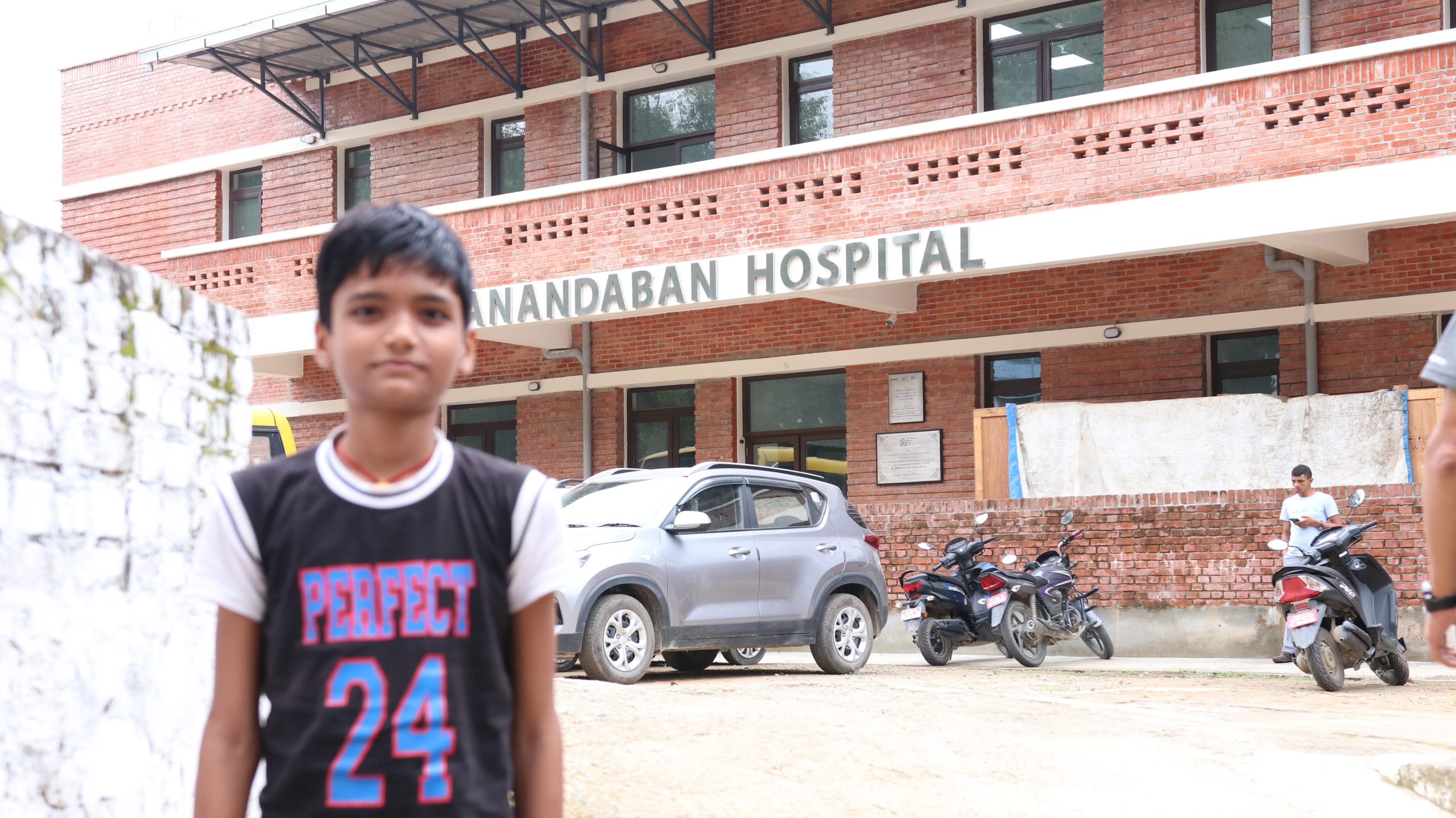 Rhitik standing outside Anandaban Hospital.