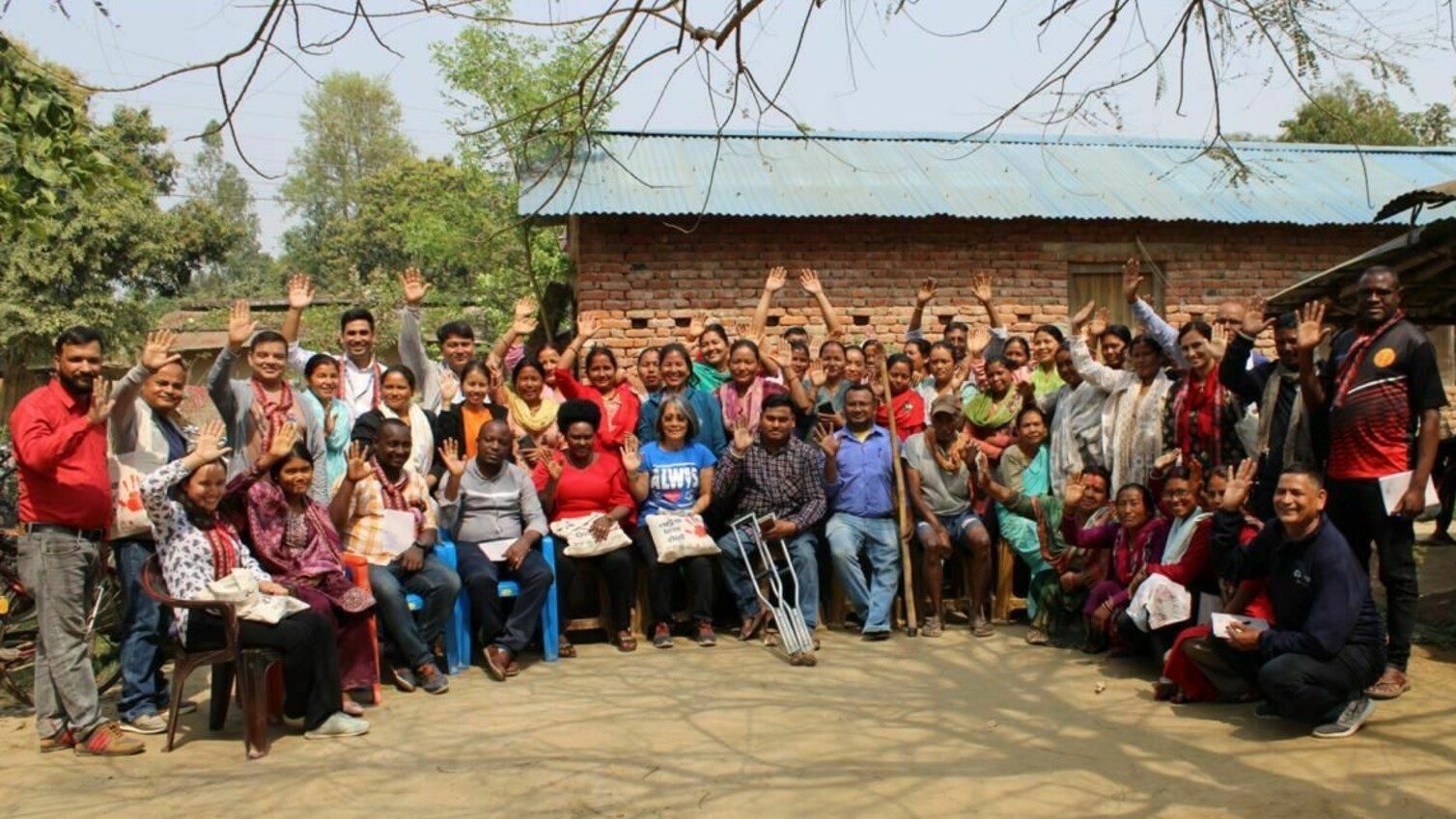 Santosh Nepali meeting with community members during a field visit in Nepal.