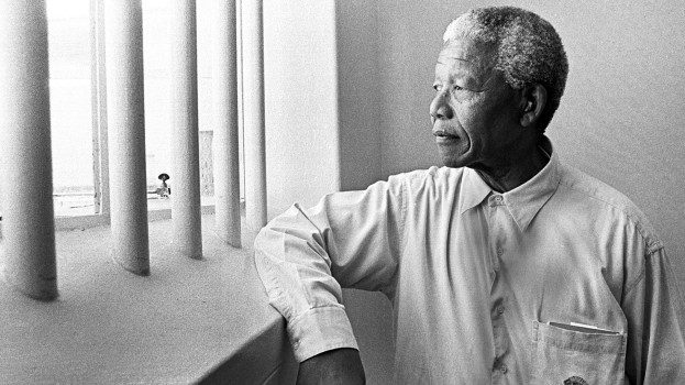 Nelson Mandela inside his former prison cell on Robben Island, South Africa.